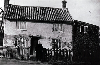 Pear Tree Cottage with Mrs Crawley about 1920 [Z50/136/21]